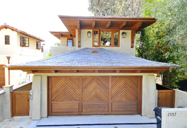 A Lighter Green Stucco With Beautiful Wooden Accents A Lighter Green Stucco With Beautiful Wooden Accents