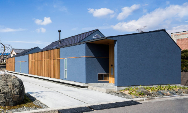 Blue Stucco With Stained Wood And Metal Roof Blue Stucco With Stained Wood And Metal Roof
