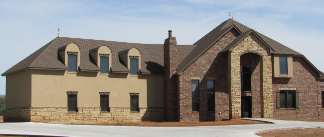 Large House With Darker Stucco, Brick And Stone