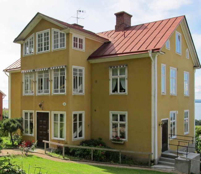Large, Yellow House With Red Metal Roof Large, Yellow House With Red Metal Roof